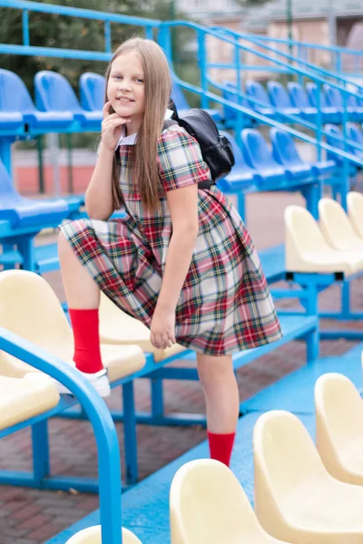 Pretty Girl School Dress Uniform Blue Yellow Tribune School Stadium —  Fotos de Stock