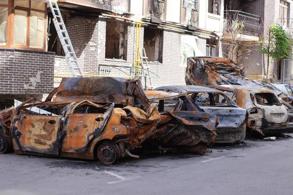 war in ukraine. Car graveyard. Shot cars of civilians. russia\'s war against Ukraine. Burnt and blown up car. Cars damaged after shelling. irpin bucha. war crimes.