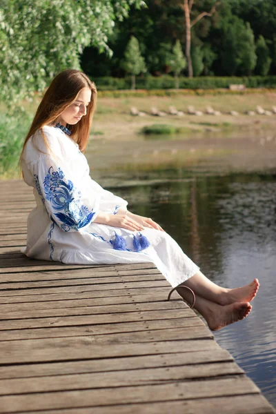 Girl Embroidered Ukrainian Shirt Sits Pier Reflection Clouds Water Lake — 스톡 사진