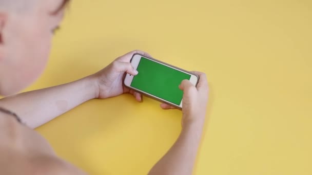 Child Using Phone Green Mock Surfing Internet Watching Content Videos — Wideo stockowe