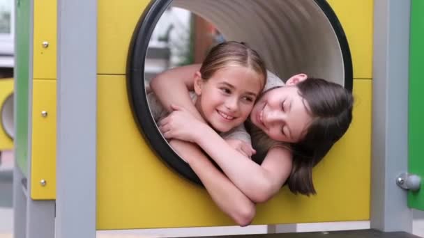 Two Pretty Teen Girls Playing Modern Playground Identical Clothes Sister — Stock Video