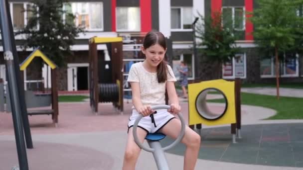 Two Pretty Teen Girls Playing Modern Playground Identical Clothes Sister — Vídeo de Stock