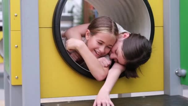 Two Pretty Teen Girls Playing Modern Playground Identical Clothes Sister — Stock Video