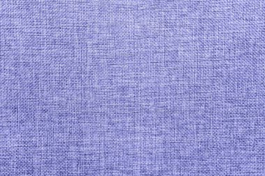 Doğal çuval bezi dokusuna sahip soyut ve boş bir arkaplan. Ekoloji dostu, pürüzsüz kumaş iplikleri 2022 yılının renginde. Uzayı kopyala Doğrudan yukarıdan yüzey.