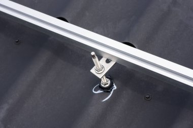 Brackets solar panel mounting system. Process of mounting solar power system on the roof. Turnkey solar power system, service works. Alternative energy. Rooftop solar power system