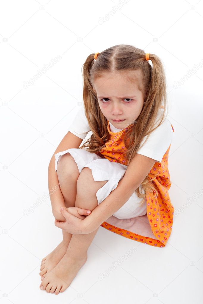 Sadness - extremely unhappy little girl sitting