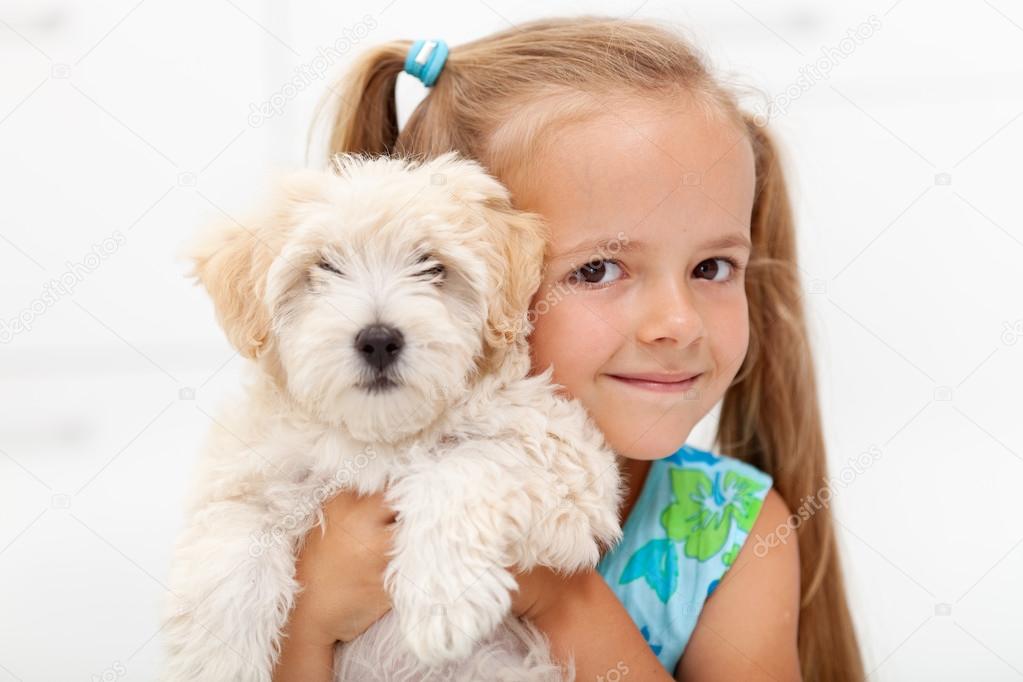 Little girl with her fluffy dog