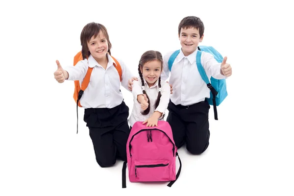 Feliz escuela niños dando pulgares hacia arriba signo Fotos de stock