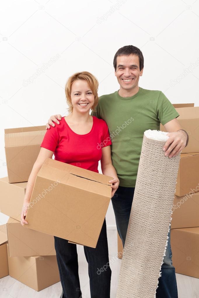 Happy couple moving into a new home