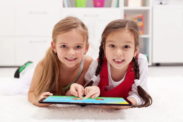 Little girls using tablet computer as artboard — Stock Photo, Image