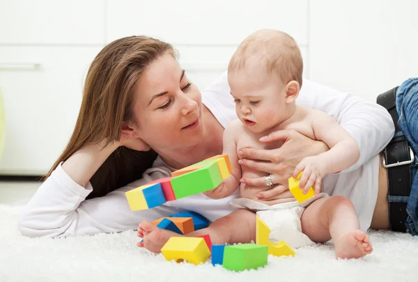 Baby boy playing with colorful blocks — Stock Photo, Image