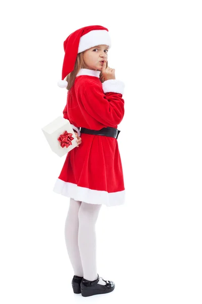 Girl in santa costume preparing a surprise — Stock Photo, Image