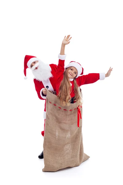 Santa Claus surprised by helper popping out of the bag — Stock Photo, Image