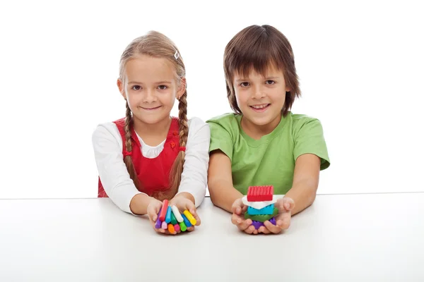 Kids with colorful clay blocks — Stock Photo, Image