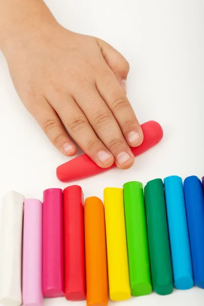 Child hand with modeling clay — Stock Photo, Image