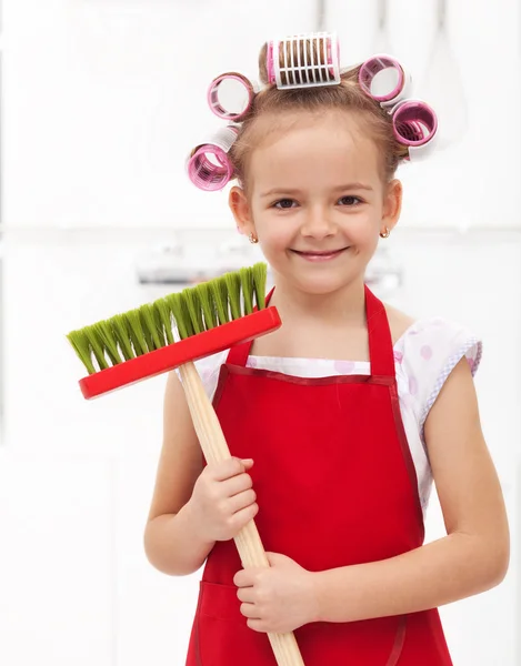 Little housekeeping fairy girl with large hair curls — Stock Photo, Image