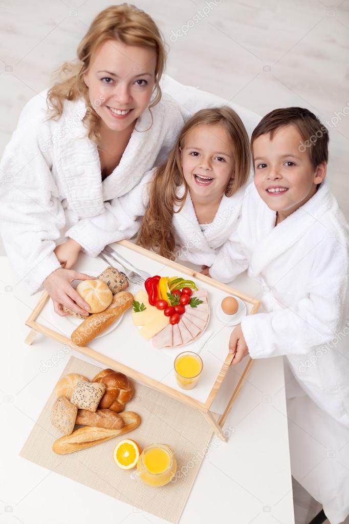 Woman and kids having a light and healthy snack