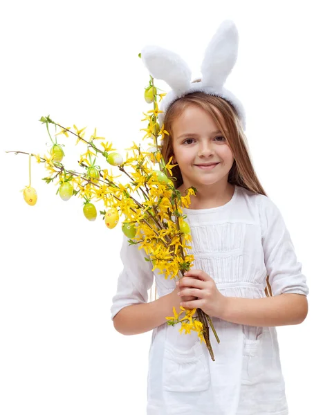 Gelukkig meisje met bunny oren en Lentebloemen — Stockfoto