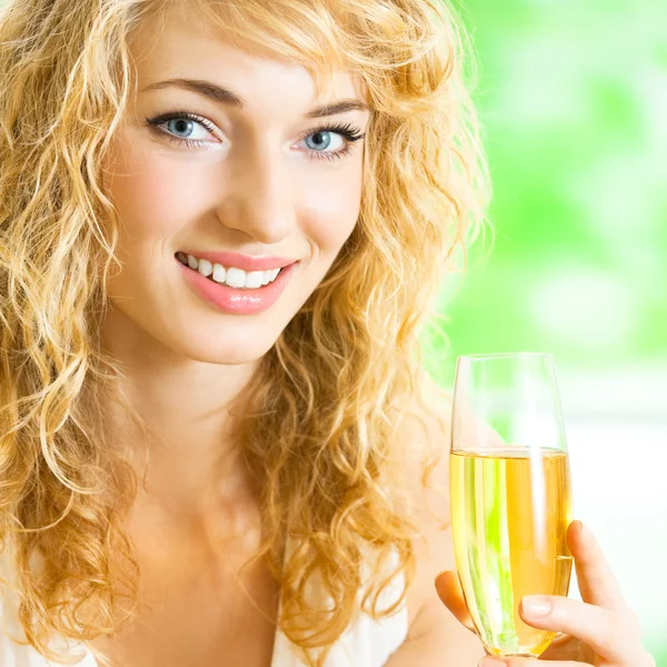 Young woman with glass of champagne — Stock Photo, Image