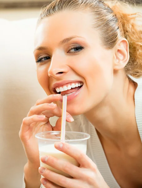 Cheerful woman drinking milk Royalty Free Stock Images