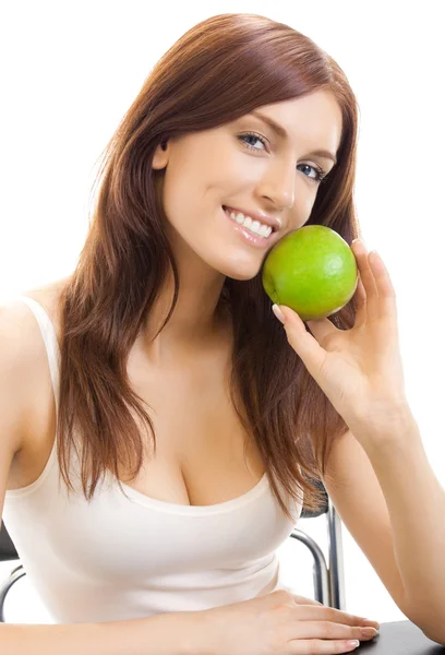 Donna allegra mangiare mela, oltre bianco — Foto Stock