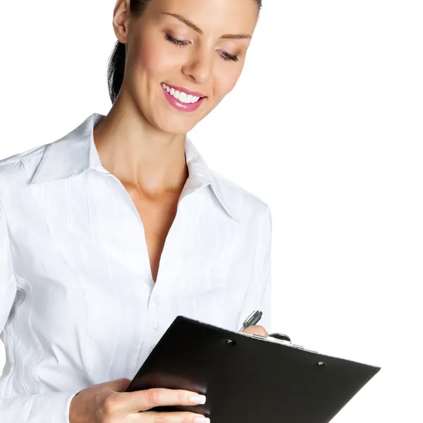 Cheerful beautiful business woman with clipboard writing, isolat — Stock Photo, Image