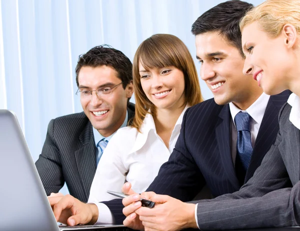 Businesspeople working with laptop Stock Image