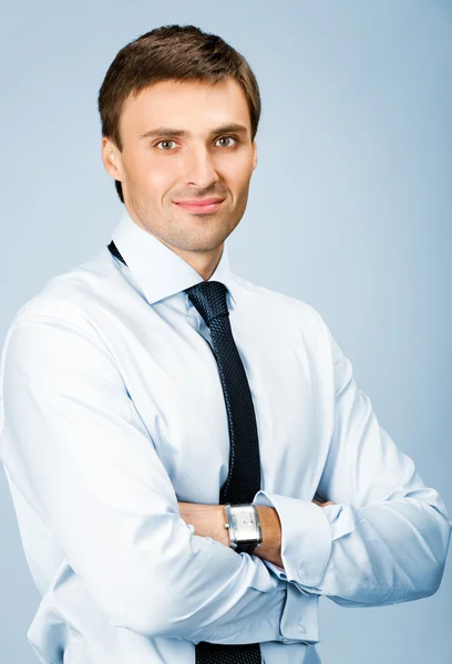 Retrato del hombre de negocios, sobre fondo azul — Foto de Stock