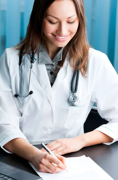 Writing doctor at office — Stock Photo, Image