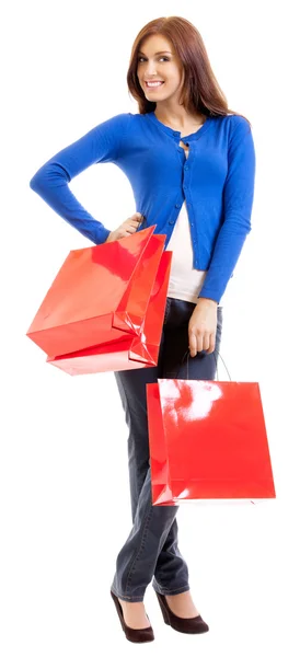 Mujer alegre con bolsas de compras, sobre blanco — Foto de Stock