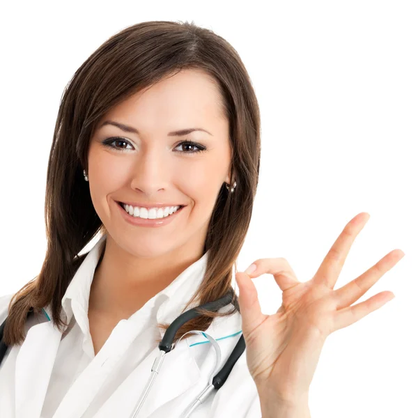 Doctor with okay gesture, isolated Royalty Free Stock Images