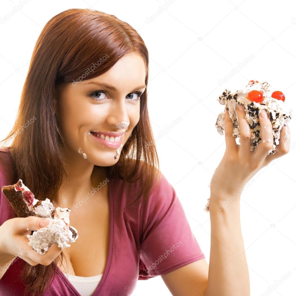 Cheerful woman eating pie, over white