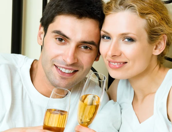 Cheerful couple with champagne — Stock Photo, Image