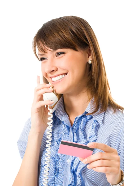 Young happy smiling business woman with plastic card, on phone — Zdjęcie stockowe