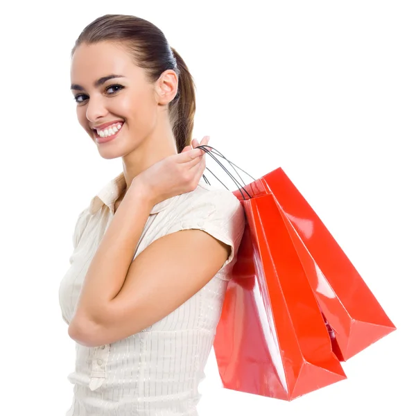 Jovem mulher feliz com sacos de compras, isolado — Fotografia de Stock