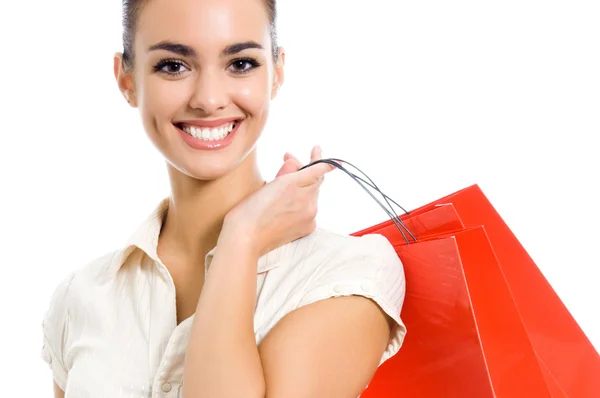 Jovem mulher feliz com sacos de compras, isolado — Fotografia de Stock
