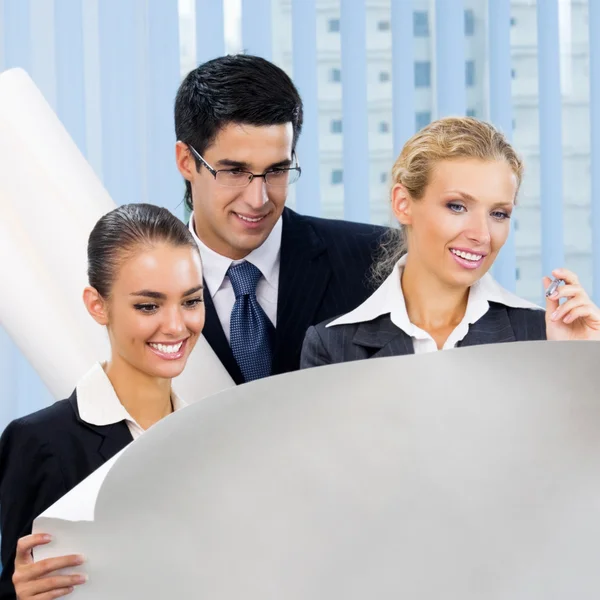 Three businesspeople working at office Stock Image