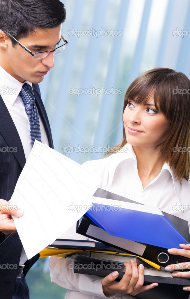Businesspeople with documents at office