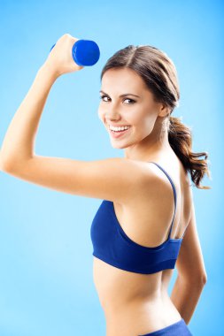 kadın fitness aşınmaya mavi ele dumbbell ile