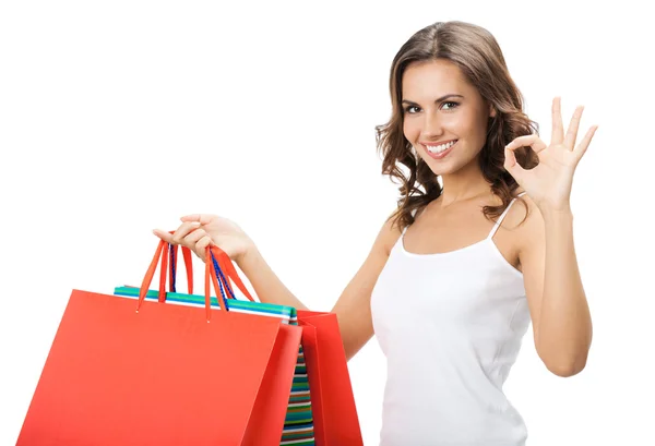 Jovem mulher feliz com sacos de compras, isolado — Fotografia de Stock