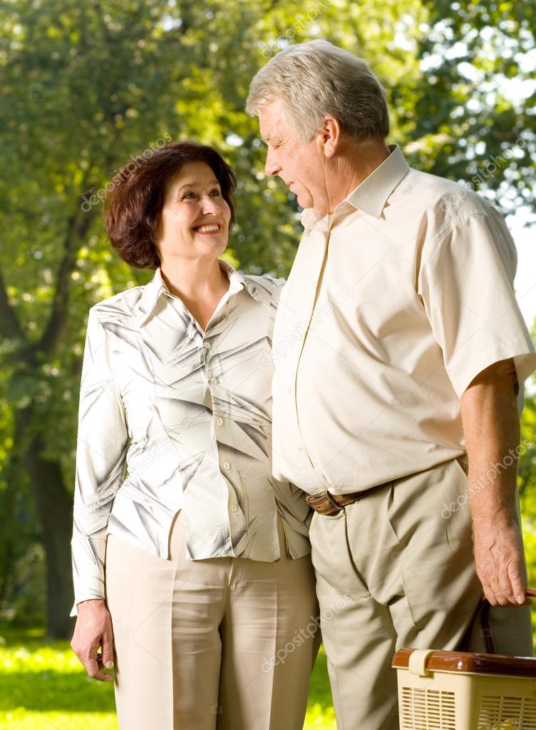 Happy senior couple walking outdoor