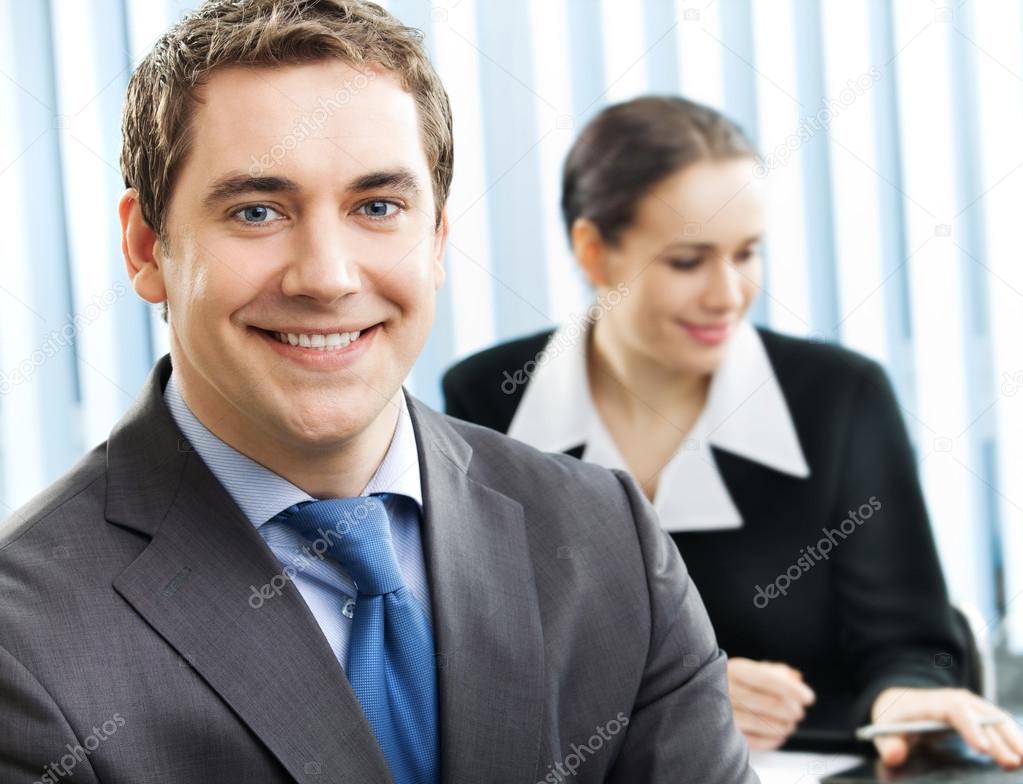 Portrait of smiling businessman at office