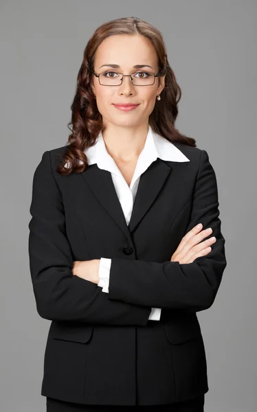 Mujer de negocios sonriente, sobre gris — Foto de Stock