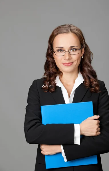 Businesswoman with folder, on gray — Stock Photo, Image