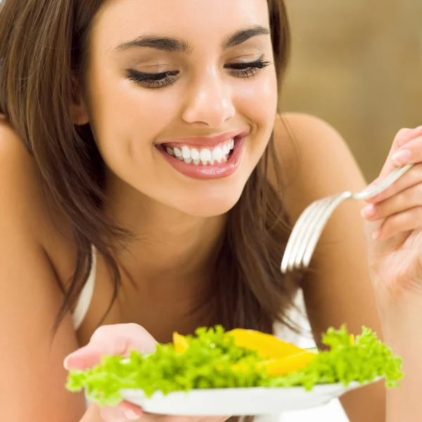 Young woman with salad, at home — Stock Photo, Image