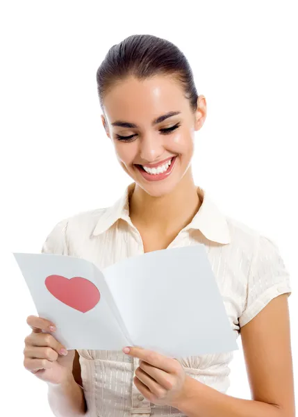 Young happy woman reading valentine card, isolated Stock Image