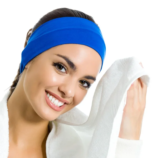 Cheerful woman in fitness wear with towel, over white — Stock Photo, Image