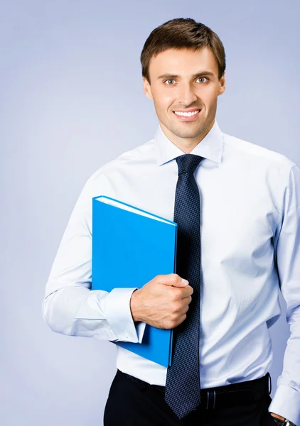 Business man with folder, on violet — Stock Photo, Image