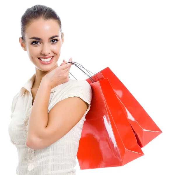 Joven mujer feliz con bolsas de compras, aislado — Foto de Stock