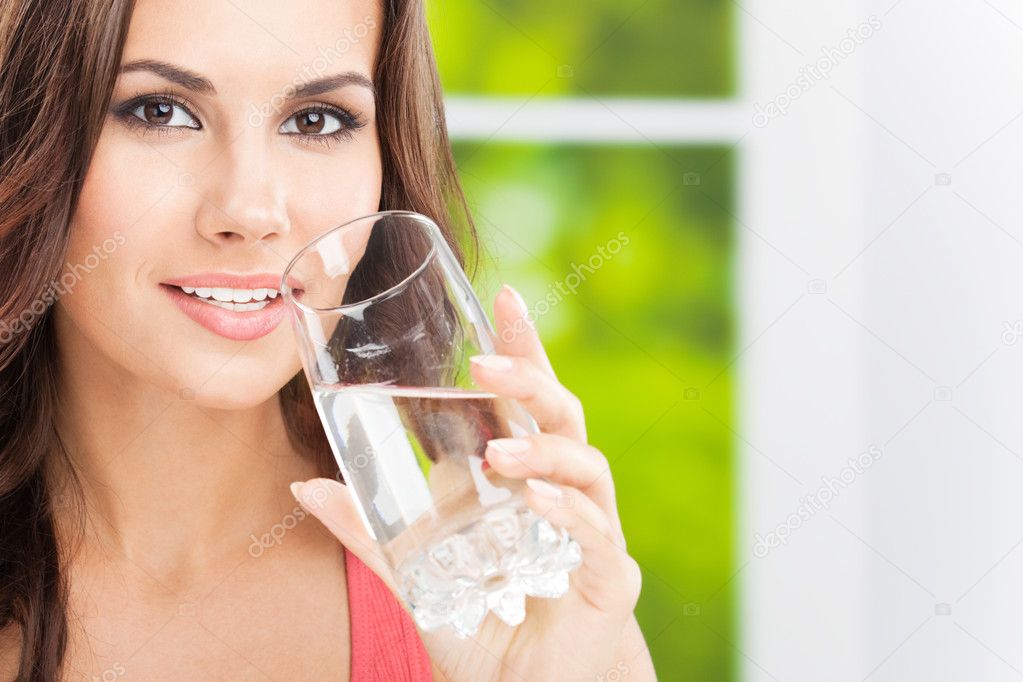 Young woman drinking water, outdoor